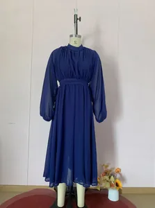 Detailed view of an elegant navy blue mesh dress featuring lantern sleeves and a cinched waist
