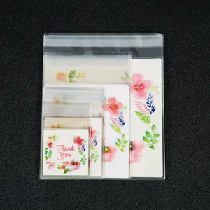 Various sizes of transparent self-sealing jewelry bags with floral Thank You cards.