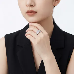 Luxurious 925 silver four-row moissanite pavé band ring presented on a female model
