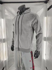 Detail showing the grey pineapple grid texture of this men's zip-up hoodie.