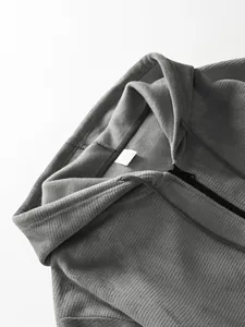 Close-up of the premium pineapple grid fabric on this grey men's hooded zip-up jacket