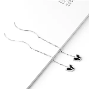 Elegant silver-toned long tassel threader earrings with black butterfly charms.
