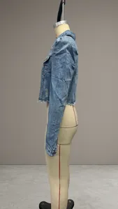 Side view of a stylish blue cropped denim jacket with raw hem displayed on a mannequin