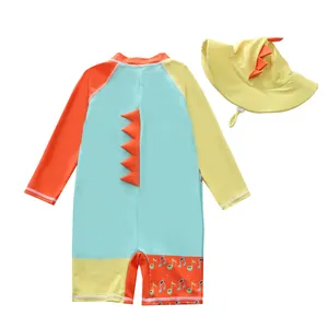 Cute cartoon dinosaur children's one-piece swimsuit set featuring a matching yellow sun hat