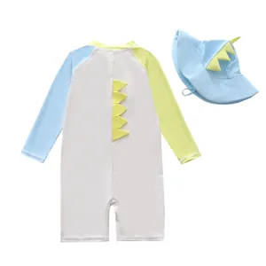 Back view of cute dinosaur kids one-piece swimsuit with matching sun hat detail.