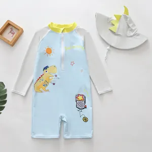 Adorable children's one-piece swimsuit with dinosaur print and matching sun hat.