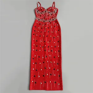 Detail view of red bandage maxi dress with rhinestone and bead embellishments.
