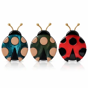 Handmade acrylic ladybug brooches in red, blue, and green marble textures for women