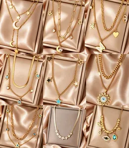 Collection grid of 18K gold plated necklaces featuring star, moon, and butterfly charms.