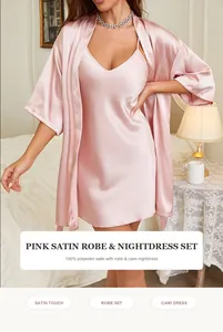 Luxurious pink satin robe and cami nightdress set shown in a cozy bedroom setting