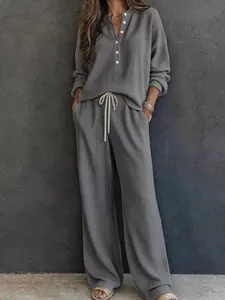 Women's grey waffle knit two-piece set with henley long sleeve top and wide-leg pants