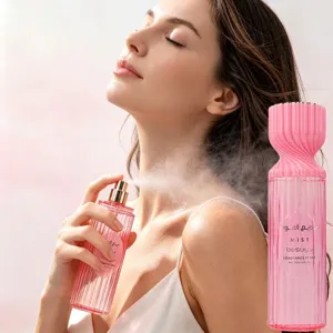 Elegant Bosuya pink ribbed fragrance spray bottle showing fine mist application on skin