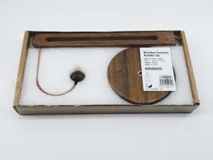 Components of a solid wood kitchen paper towel rack inside protective foam packaging