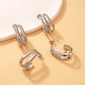 Detailed view of minimalist triple-layered silver titanium steel geometric hoop earrings