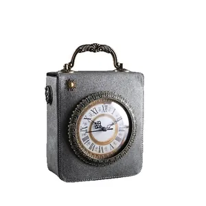 Silberne Vintage-Box-Handtasche mit dekorativem Zifferblatt und bronzefarbenem Griff