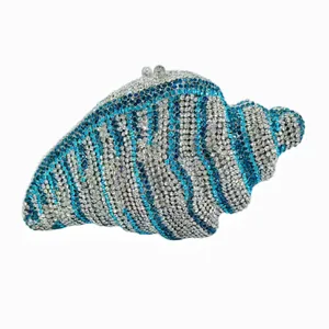 Elegant shell-shaped evening clutch bag adorned with sparkling blue and silver rhinestones.
