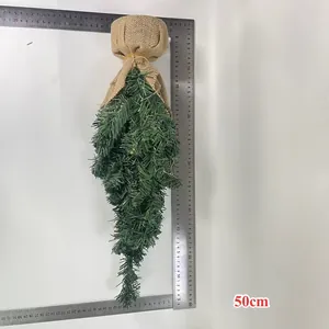 Macro view of artificial pine Christmas teardrop swag with burlap top, 50cm long
