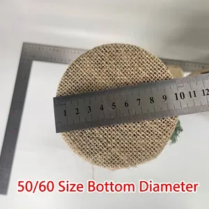 Detailed macro view showing the bottom diameter measurement of a burlap tree base