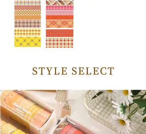 Detailweergave van de geruite washi-tape set in warme oranje tinten met verpakking.
