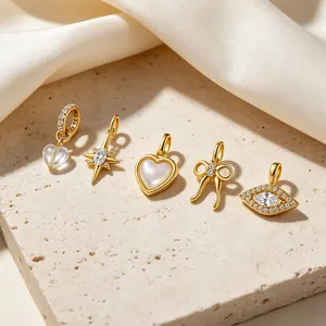 Eleganti ciondoli in argento s925 placcato oro con motivi a cuore, stella e fiocco