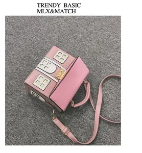 Top view of a creative pink house-shaped crossbody bag with cute window details.