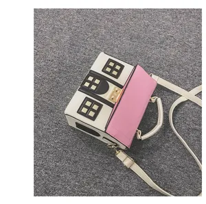 Detailed top view of house-shaped crossbody bag in pink and white contrast