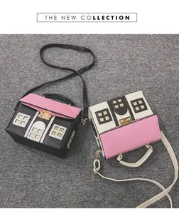 Detailed view of two creative house-shaped handbags in black, white, and pink leather textures.