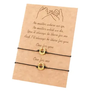 Handmade horseshoe charm friendship braided bracelet set on a sentimental gift card