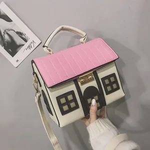 Unique house shaped crossbody bag featuring a cute pink roof and off-white colorblock