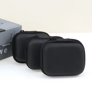 Close-up detail of three portable black EVA hard-shell storage cases for digital accessories