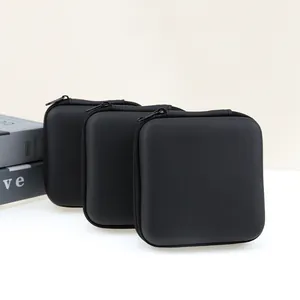 Close-up detail view of three black EVA hard shell storage cases for earphones and accessories