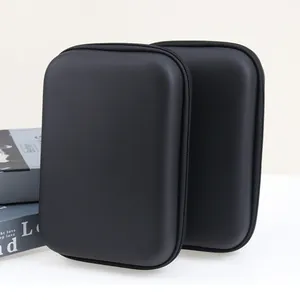 Detailed view of two portable matte black EVA hard cases for digital electronics