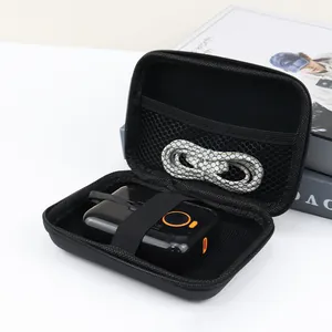 Interior detail of portable black EVA storage bag organized with electronic accessories.
