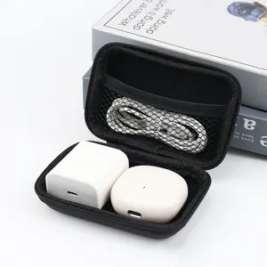 Detailed interior of a black EVA portable case storing a charger, cable, and earbuds