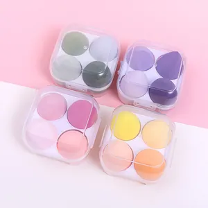 Set of 4 teardrop-shaped makeup sponges in individual clear storage cases