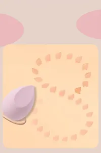 Detailed view of lavender makeup sponge with swatches showing consistent powder release.