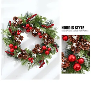 Detailed macro view of 50cm Christmas wreath with snow-dusted pine cones and red berries