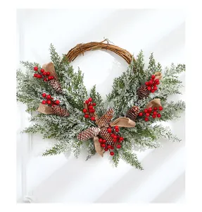 Festive 50cm Christmas wreath with snow-dusted pine, red berries and natural cones