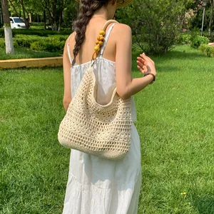 Large handmade crochet woven bag for women with decorative wooden bead handle for beach