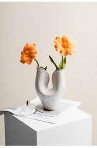 Modern artistic white ceramic vase with unique dual opening and distressed texture finish