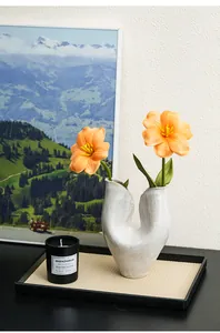 Artistic U-shaped white ceramic vase with rustic texture for minimalist home decor
