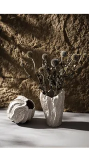 Detail view of artistic ceramic vases with organic textures in a wabi-sabi home