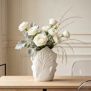 Close-up of wabi-sabi ceramic vase featuring natural leaf vein texture for home decor