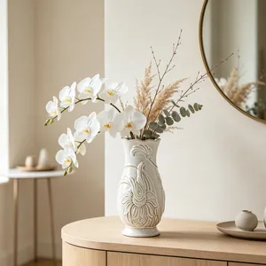 Detailed view of an elegant white ceramic vase with relief floral carving for home