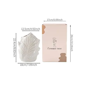 Dimension detail for leaf-textured ceramic vase and matching gift box packaging