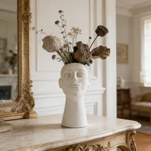 Elegant white ceramic human face bust vase with dried flower arrangement for decor