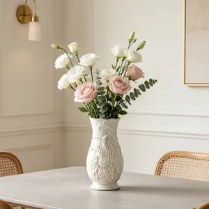 Detailed view of French art ceramic vase with elegant floral embossed relief patterns