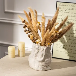 Modern white ceramic flower vase shaped like a tote bag for elegant home interior