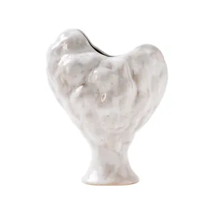 Minimalist white heart-shaped ceramic vase with unique organic texture and matte finish