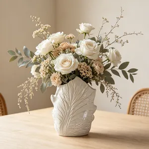 Close-up of Wabi-sabi ceramic vase featuring natural leaf-vein texture for home decor
